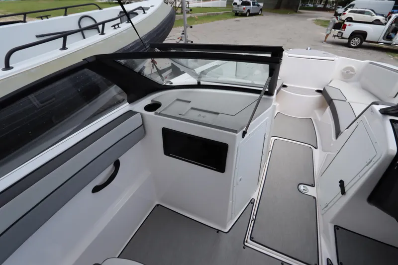 Slide: The Image of 2024 Yamaha Boats SX220 interior with sleek seating and modern design. - 10