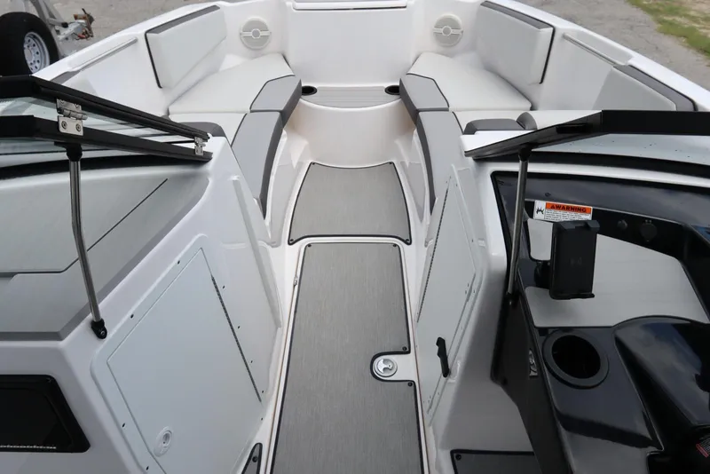 Slide: The Image of 2024 Yamaha Boats SX220 interior with spacious seating and modern design. - 11