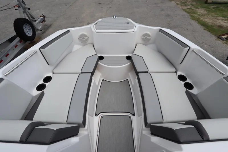 Slide: The Image of 2024 Yamaha Boats SX220 interior with spacious seating and cup holders. - 12
