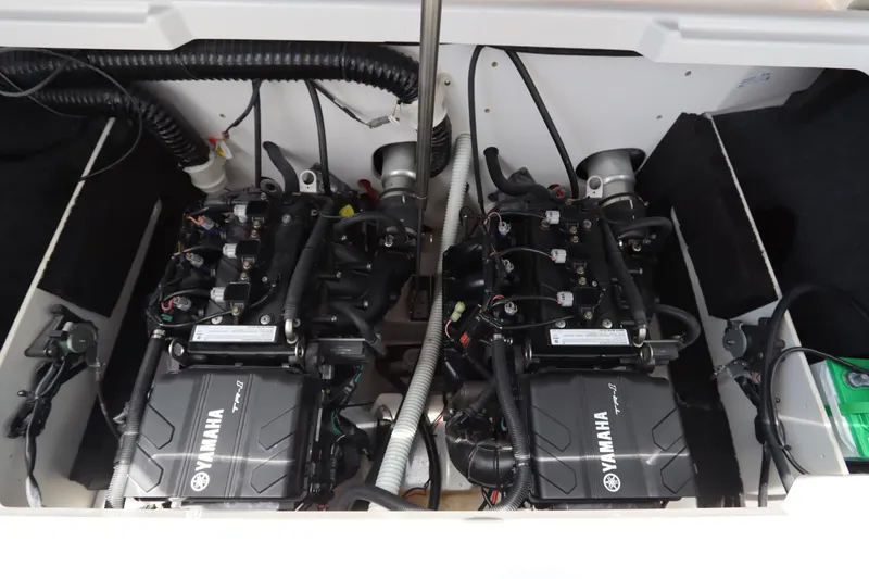 Slide: The Image of 2024 Yamaha SX220 boat engine compartment with dual engines and wiring. - 22
