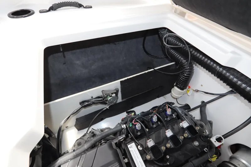 Slide: The Image of 2024 Yamaha Boats SX220 engine compartment with visible wiring and components. - 26