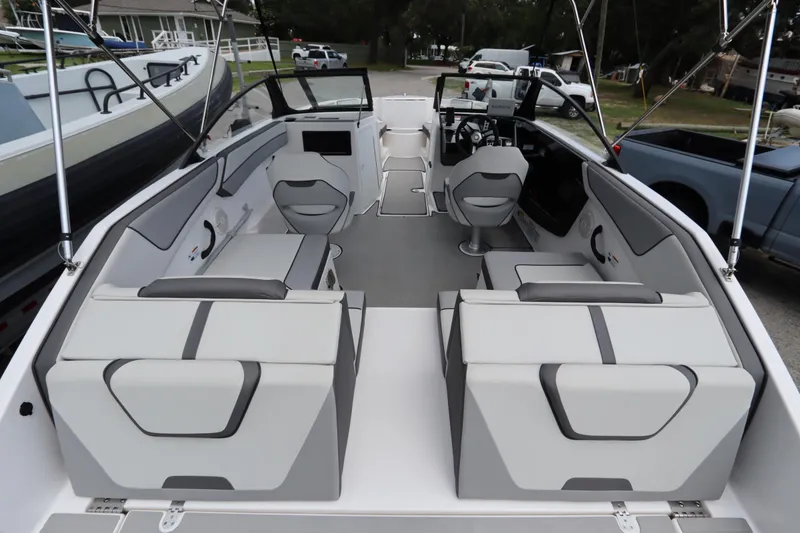Slide: The Image of 2024 Yamaha Boats SX220 interior with modern seating and sleek design. - 5