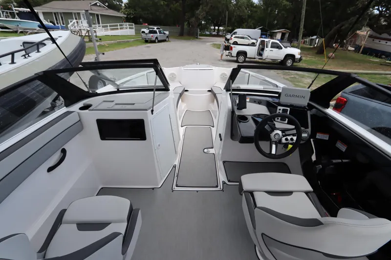 Slide: The Image of 2024 Yamaha Boats SX220 interior with modern dashboard and seating. - 6