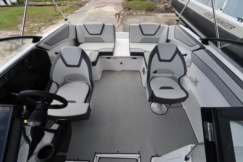 Slide: The Image of 2024 Yamaha Boats SX220 interior with modern seating and steering wheel. - 8