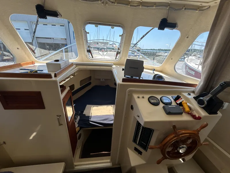 Slide: The Image of 2005 Rosborough RF-246 Custom Wheelhouse interior with navigation equipment and wooden steering wheel. - 3