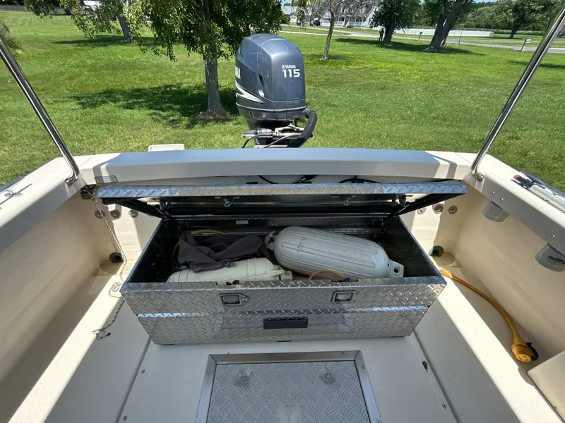 Slide: The Image of 2005 Rosborough RF-246 boat with open storage compartment and Yamaha 115 outboard motor. - 7