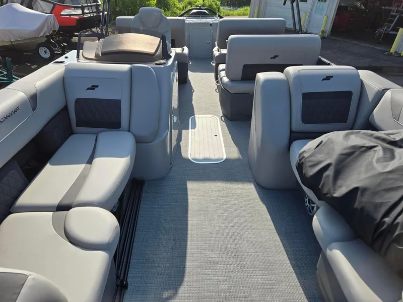 Slide: The Image of 2026 Starcraft CX23RL boat interior with gray seating and spacious layout. - 5
