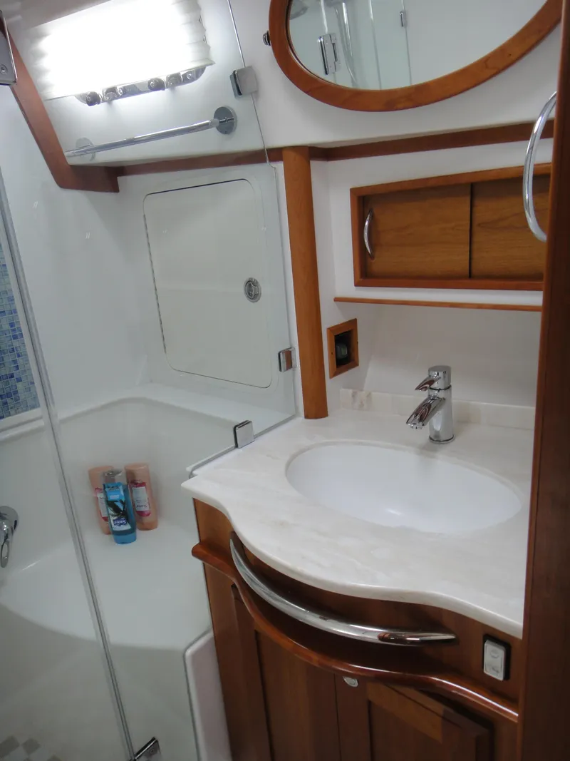Slide: The Image of Laundry area with washer and dryer inside a 2018 Sabre 48 Salon Express yacht. - 20