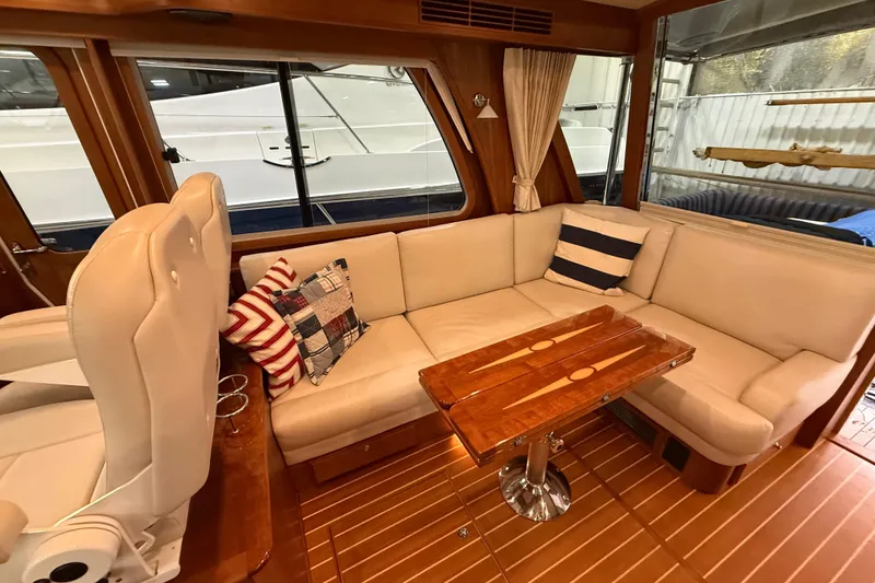 Slide: The Image of Luxurious interior of 2018 Sabre 48 Salon Express with plush seating and wooden table. - 43
