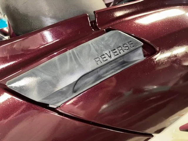 Slide: The Image of 2000 Yamaha WaveRunner XL 800 reverse lever, maroon finish, close-up view. - 10