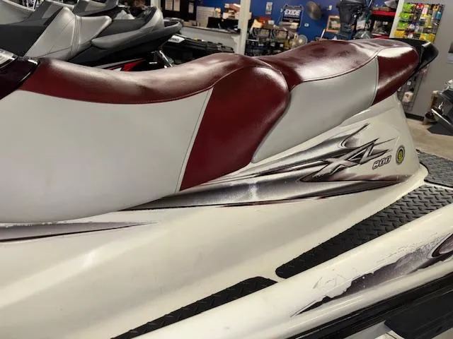 Slide: The Image of 2000 Yamaha WaveRunner XL 800 with red and white seat in showroom. - 12
