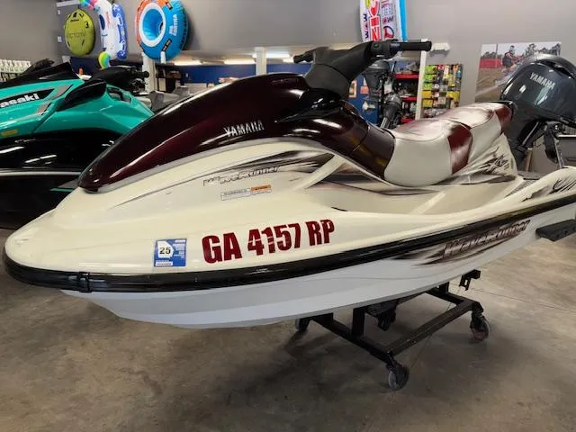 Slide: The Image of 2000 Yamaha WaveRunner XL 800 jet ski displayed indoors on a stand. - 3