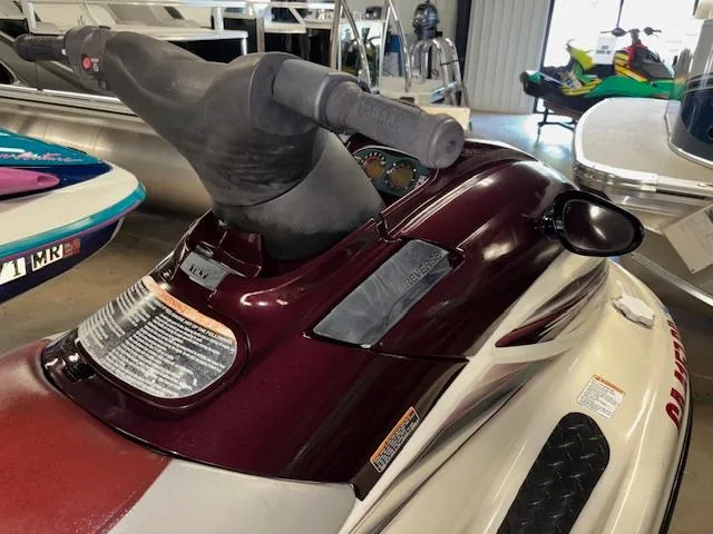 Slide: The Image of 2000 Yamaha WaveRunner XL 800 jet ski in a showroom, featuring handlebars and dashboard. - 8