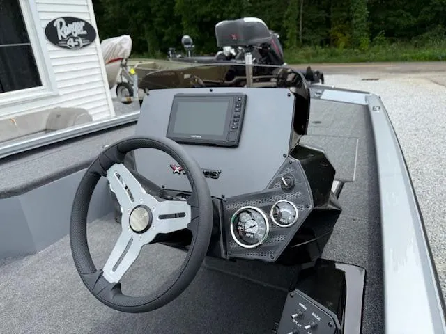 Slide: The Image of 2026 Vexus AVX181 boat dashboard with steering wheel and digital display. - 5