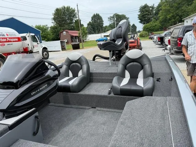 Slide: The Image of 2026 Vexus AVX181 boat with sleek seating and modern design in a parking area. - 9