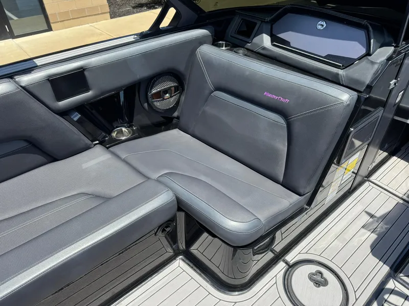 Slide: The Image of 2023 MasterCraft XStar S Piranha interior with sleek gray seating and modern design. - 10