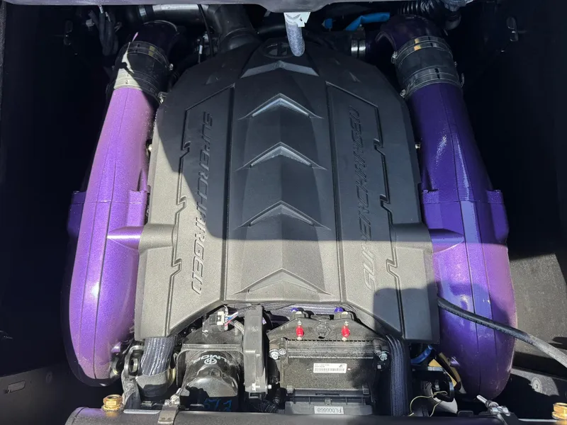 Slide: The Image of 2023 MasterCraft XStar S Piranha engine with purple components and sleek design. - 18