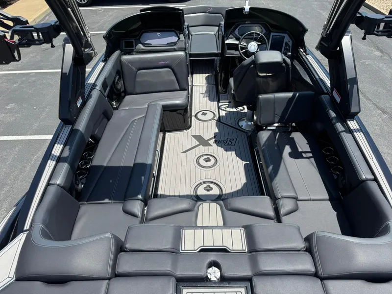 Slide: The Image of 2023 MasterCraft XStar S Piranha interior with sleek seating and modern dashboard design. - 6