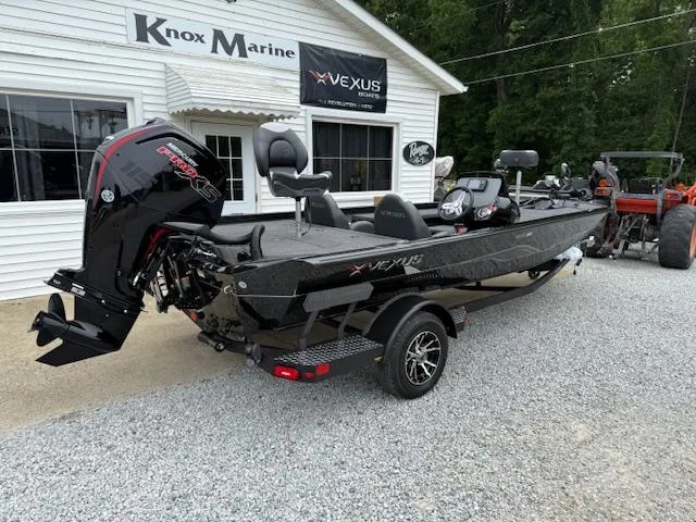Slide: The Image of 2026 Vexus AVX189 boat displayed at Knox Marine dealership. - 3