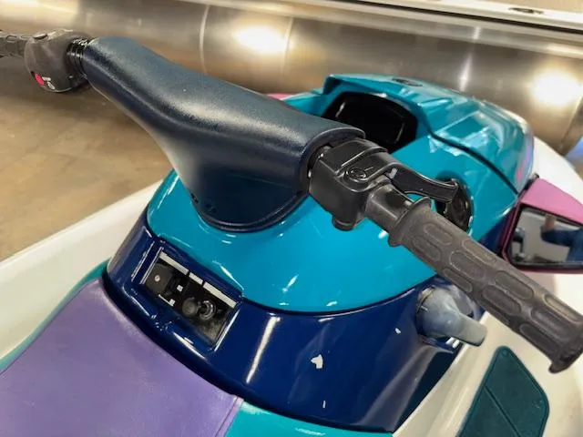 Slide: The Image of 1995 Yamaha WaveRunner Wave Venture, close-up of handlebars and seat in vibrant colors. - 6