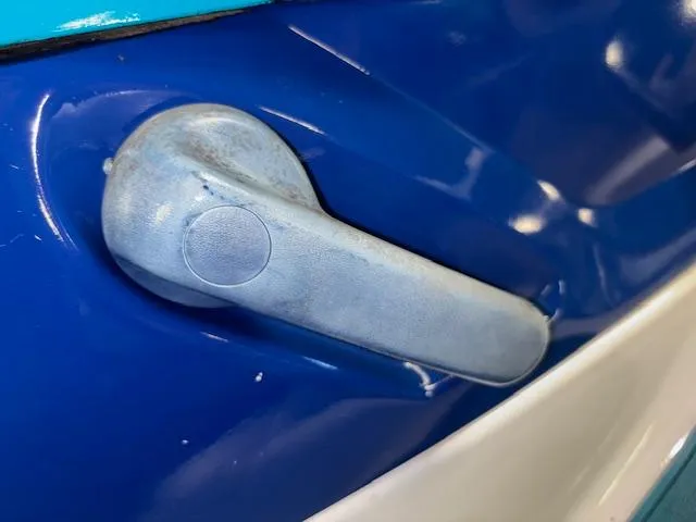 Slide: The Image of Close-up of a 1995 Yamaha WaveRunner Wave Venture handle on a blue surface. - 8