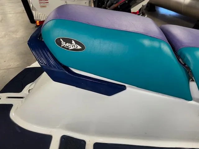 Slide: The Image of 1995 Yamaha WaveRunner Wave Venture with teal and purple seat detail. - 9