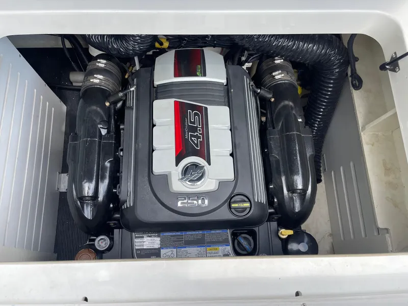 Slide: The Image of Engine compartment of a 2018 Sea Ray SPX 210 boat, featuring a 4.5L 250 HP engine. - 4
