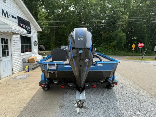 Slide: The Image of 2026 Vexus 2085s boat with V8 engine parked outside a marine shop. - 11