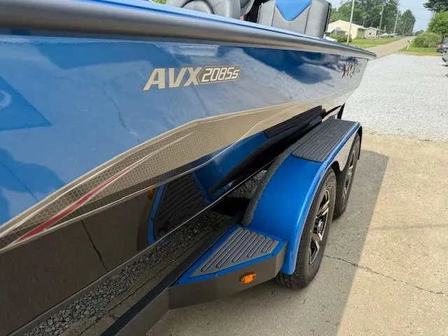 Slide: The Image of 2026 Vexus 2085s boat in blue, featuring sleek design and dual-axle trailer. - 10