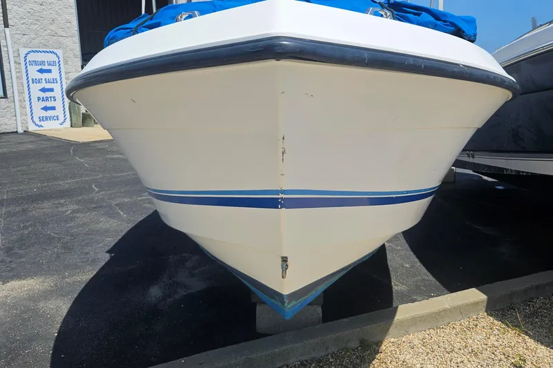 Slide: The Image of Front view of a 1994 Celebrity Fish Hawk 18 boat on display. - 3