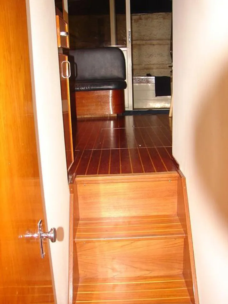 Slide: The Image of Interior of 1979 Chris-Craft 360 Commander with wooden stairs. - 10