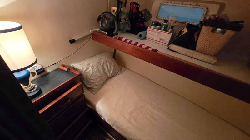 Slide: The Image of Interior of 1979 Chris-Craft 360 Commander with cozy sleeping area. - 11