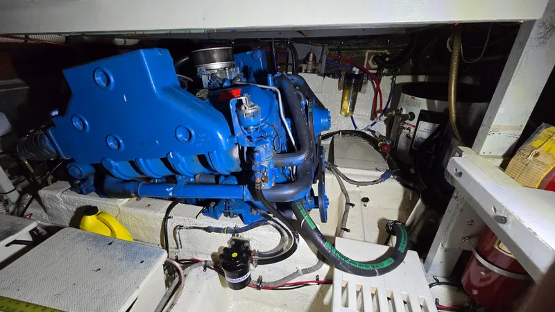 Slide: The Image of Engine room of a 1979 Chris-Craft 360 Commander with blue engine. - 16