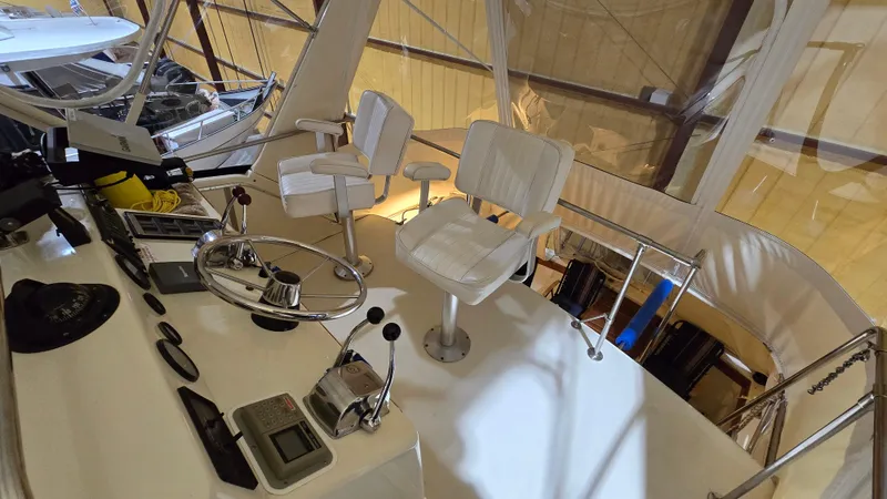 Slide: The Image of Interior view of 1979 Chris-Craft 360 Commander cockpit with controls and seating. - 20