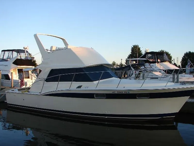 Slide: The Image of 1979 Chris-Craft 360 Commander yacht docked at sunset. - 3