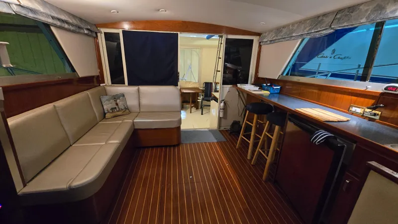 Slide: The Image of Interior of a 1979 Chris-Craft 360 Commander yacht with wooden flooring. - 4