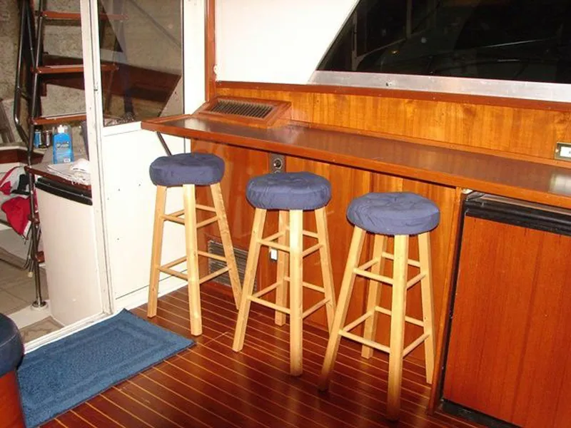 Slide: The Image of Interior of 1979 Chris-Craft 360 Commander with bar stools. - 5