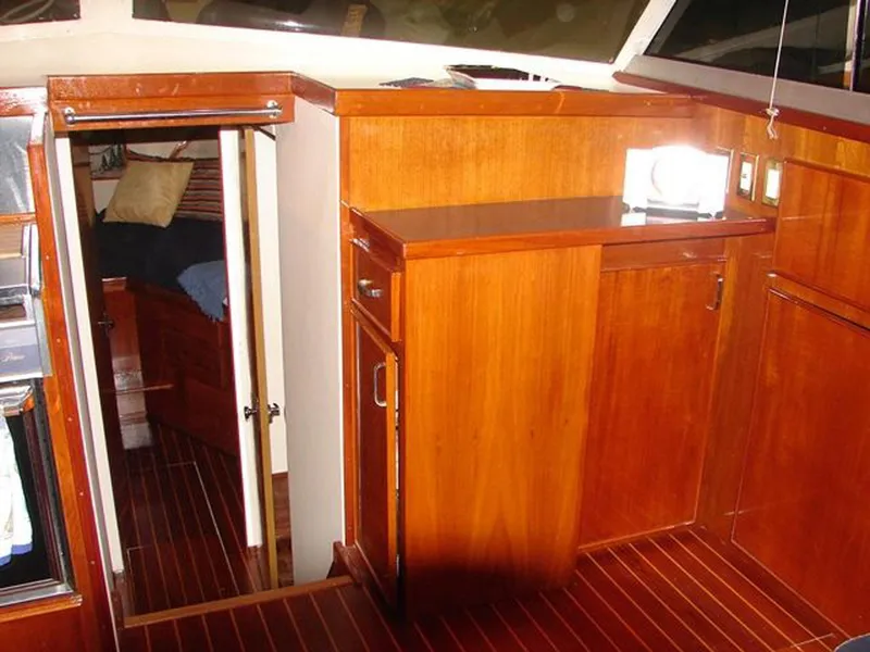 Slide: The Image of Interior of 1979 Chris-Craft 360 Commander with wooden cabinetry. - 9