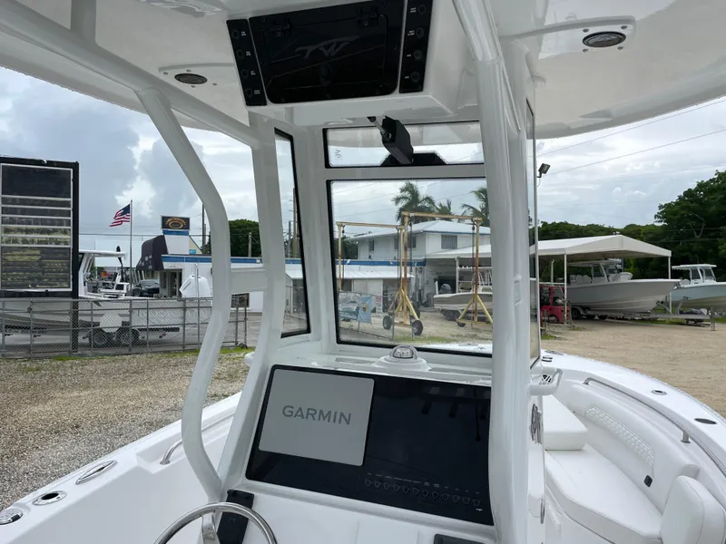Slide: The Image of 2026 Tidewater 232 CC Adventure boat interior with Garmin navigation system. - 13