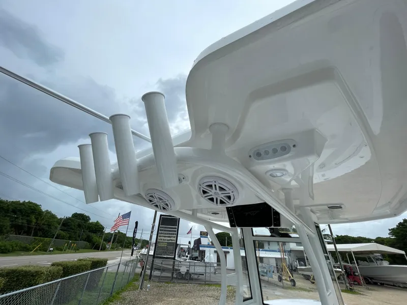 Slide: The Image of Tidewater 232 CC Adventure 2026 boat with rod holders and speakers, viewed from below. - 15