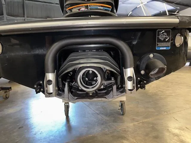 Slide: The Image of Rear view of a 2021 Kawasaki Ultra LX jet ski in a garage setting. - 13