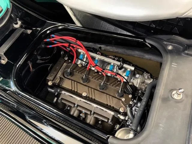 Slide: The Image of 2021 Kawasaki Ultra LX engine with red wires and detailed components. - 14