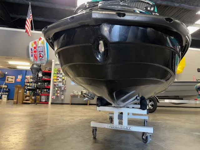 Slide: The Image of 2021 Kawasaki Ultra LX jet ski on display in a showroom with accessories. - 15