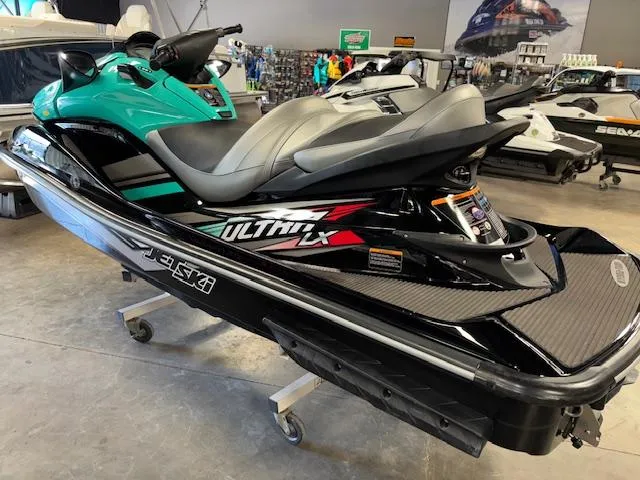 Slide: The Image of 2021 Kawasaki Ultra LX jet ski in showroom, featuring sleek design and vibrant colors. - 5