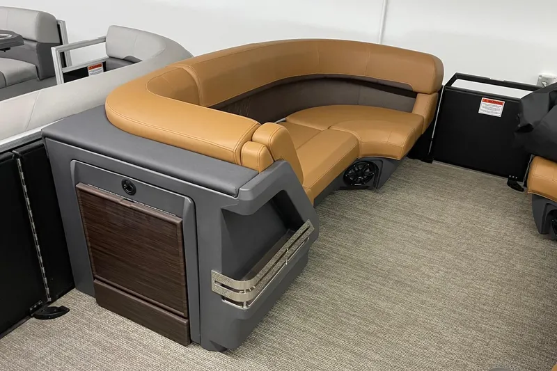 Slide: The Image of 2025 Bennington 22 M CRUISE boat interior with tan and gray seating. - 7