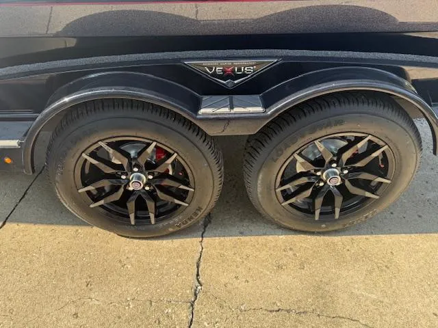 Slide: The Image of 2026 Vexus DVX22S trailer with dual black alloy wheels on concrete surface. - 11