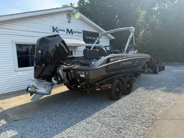 Slide: The Image of 2026 Vexus DVX22S boat on trailer at Knox Marine dealership. - 3