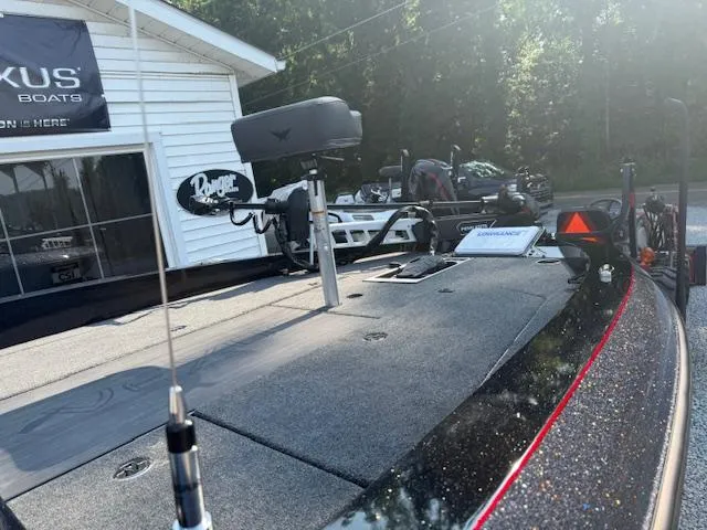 Slide: The Image of 2026 Vexus DVX22S boat with advanced equipment, parked outdoors near a showroom. - 6