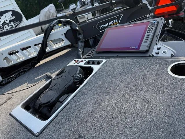 Slide: The Image of 2026 Vexus DVX22S boat dashboard with Minn Kota system and electronic display. - 7