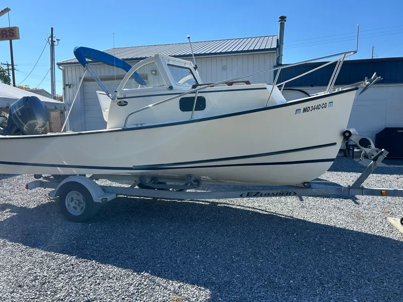 Slide: The Image of 2014 Seaway 21 Seafarer Cuddy boat on trailer, parked outdoors. - 1